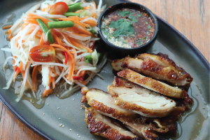 Grilled chicken thigh w/  somtam, Thai spicy sauce