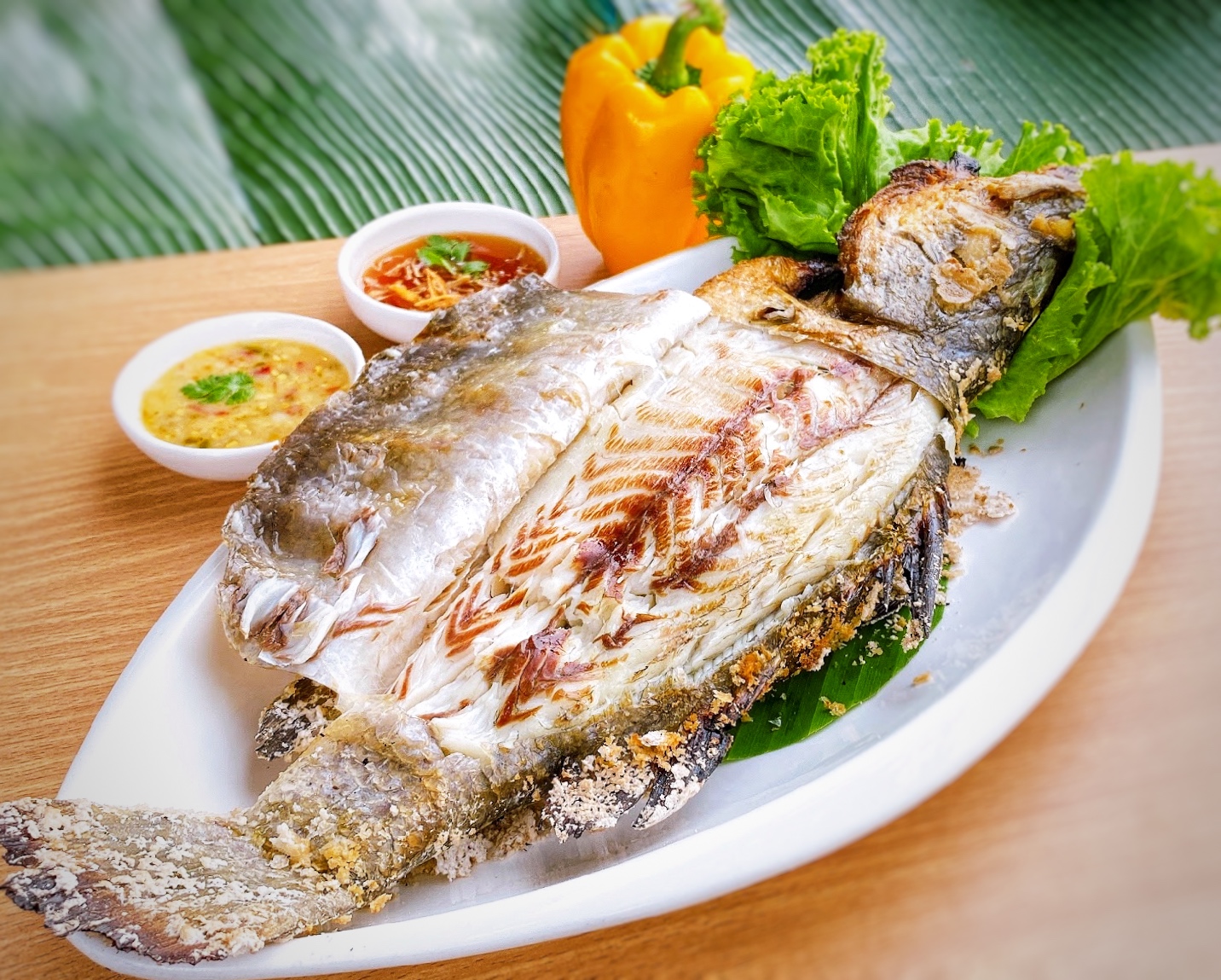 ปลากระพงอบเกลือ (Baked Sea Bass Served with Spicy Sauce)