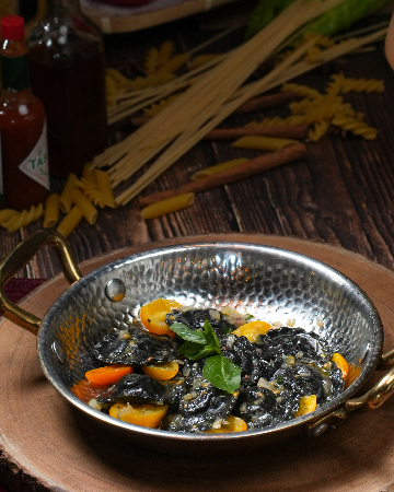 Black ravioli with seabass